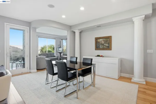 a view of a dining room with furniture window and wooden floor