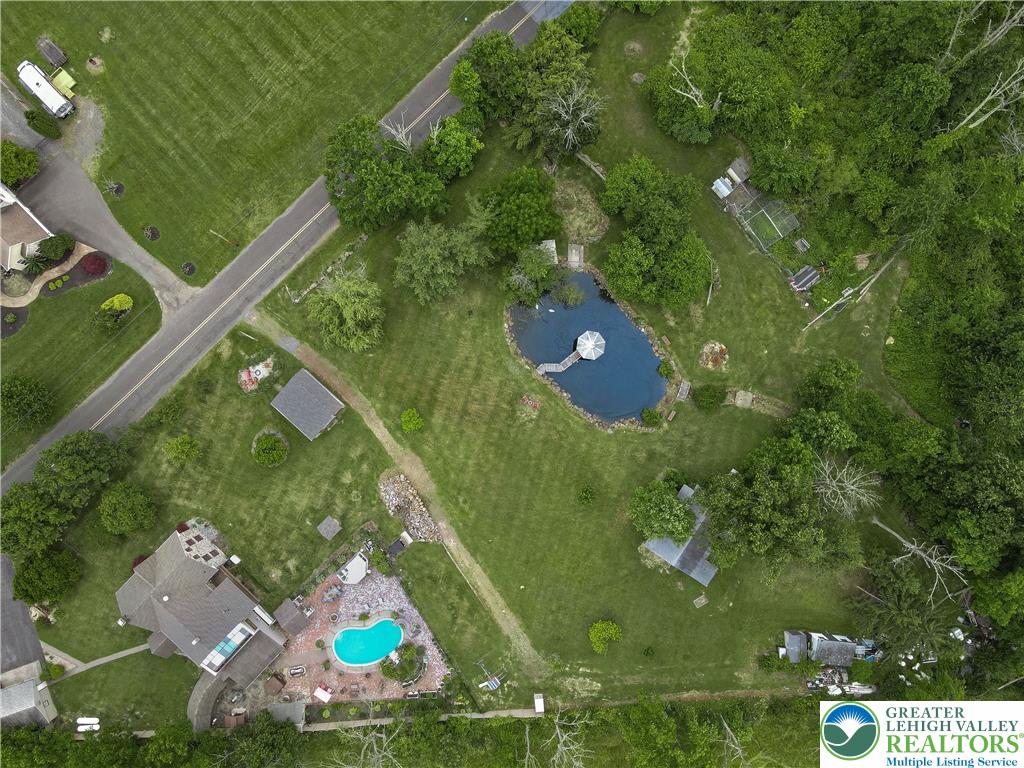 2485 Hieter Road Quakertown, PA 18951 - Photo 87 of 97 An aerial perspective reveals a large property with a private pool, a tranquil pond with a gazebo, and ample green space.