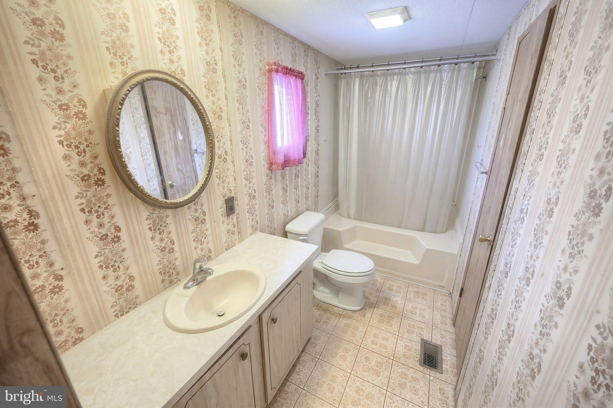 77 2nd Avenue Hanover, PA 17331 - Photo 15 of 22 a bathroom with a sink a toilet and a mirror