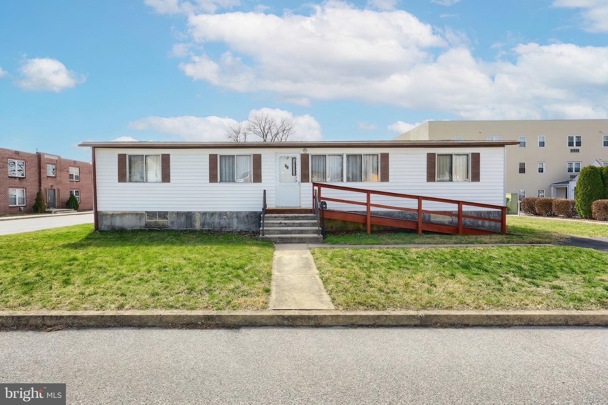 77 2nd Avenue Hanover, PA 17331 - Photo 2 of 22 a front view of a house with a garden and yard