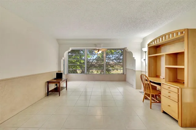 a view of kitchen with furniture and a window