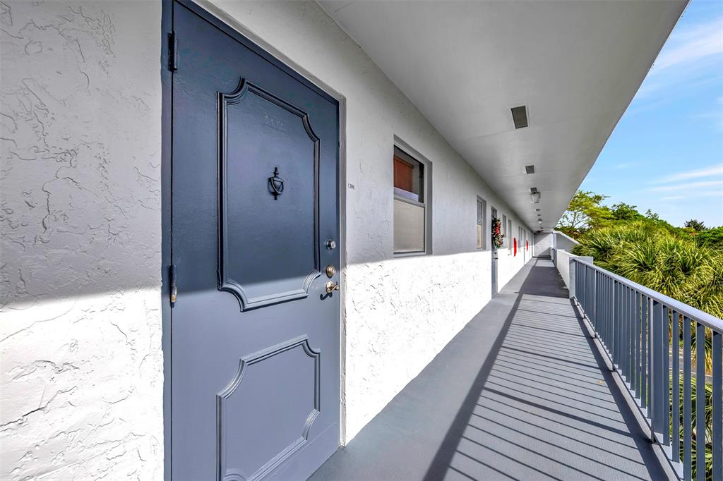 8380 Sands Point Boulevard, Unit J306 Tamarac, FL 33321 - Photo 29 of 33 a view of balcony with wooden floor