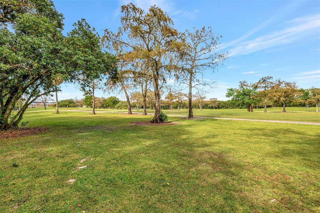 8380 Sands Point Boulevard, Unit J306 Tamarac, FL 33321 - Photo 32 of 33 a ground with lots of trees