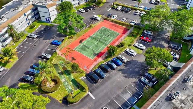 an aerial view of residential house with outdoor space and swimming pool