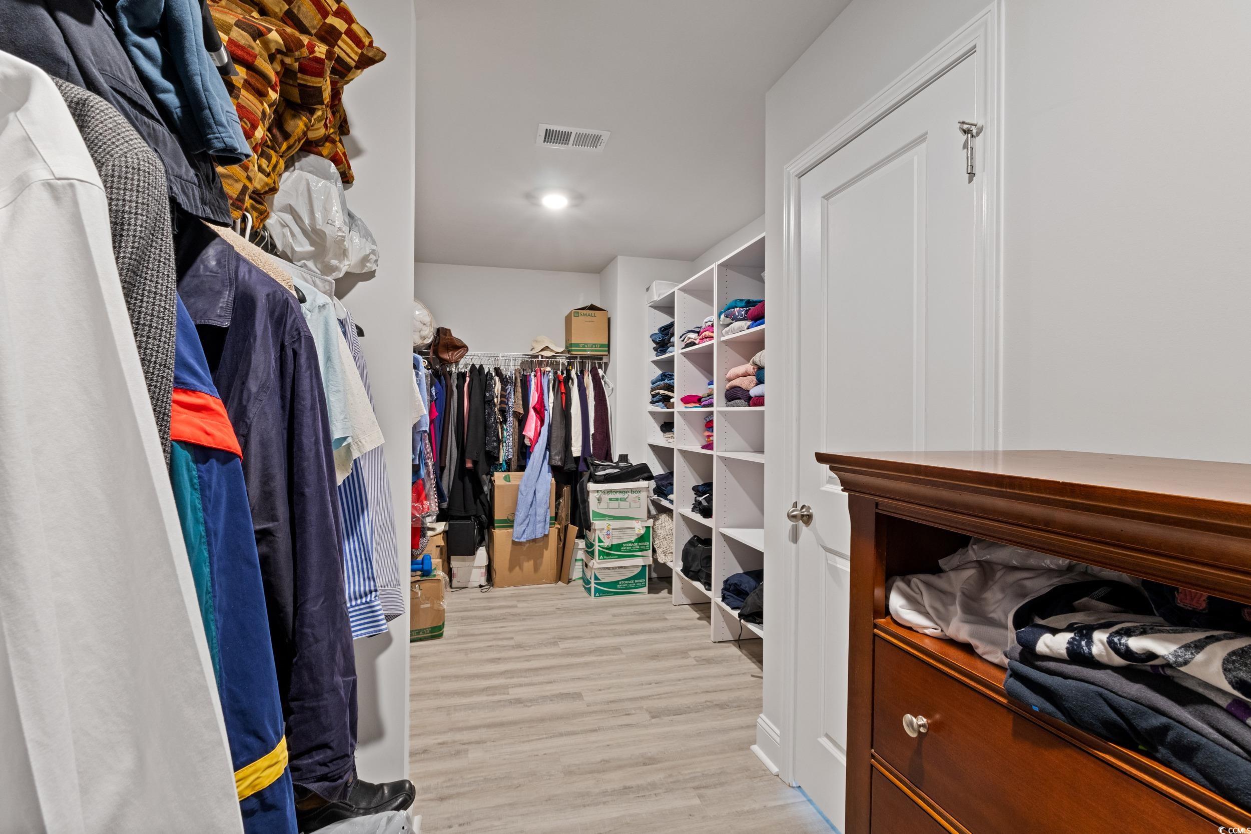 4070 Rutherford Court Little River, SC 29566 - Photo 21 of 40 Walk in closet featuring light wood-style flooring