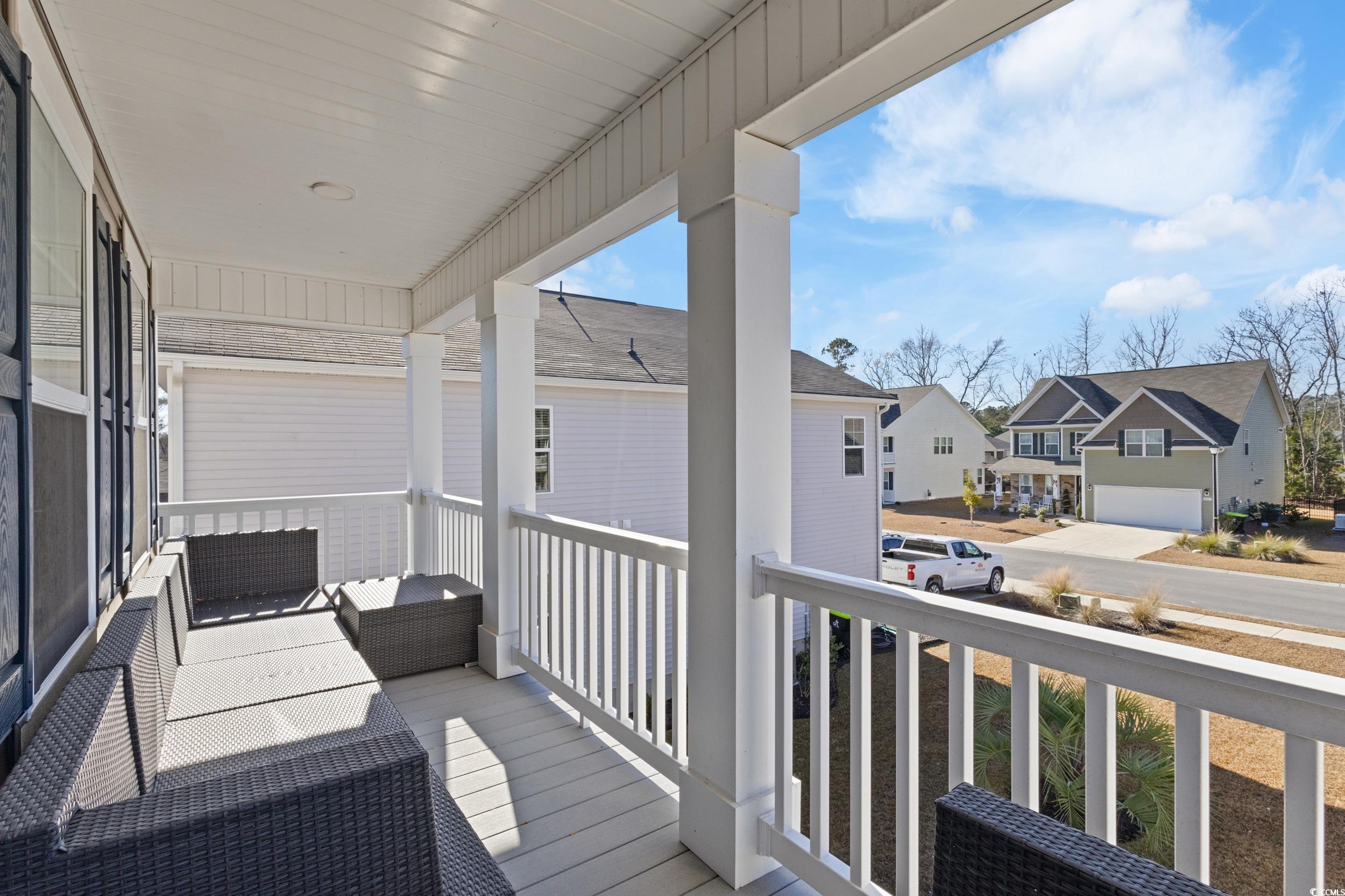 4070 Rutherford Court Little River, SC 29566 - Photo 28 of 40 Covered porch with a residential view