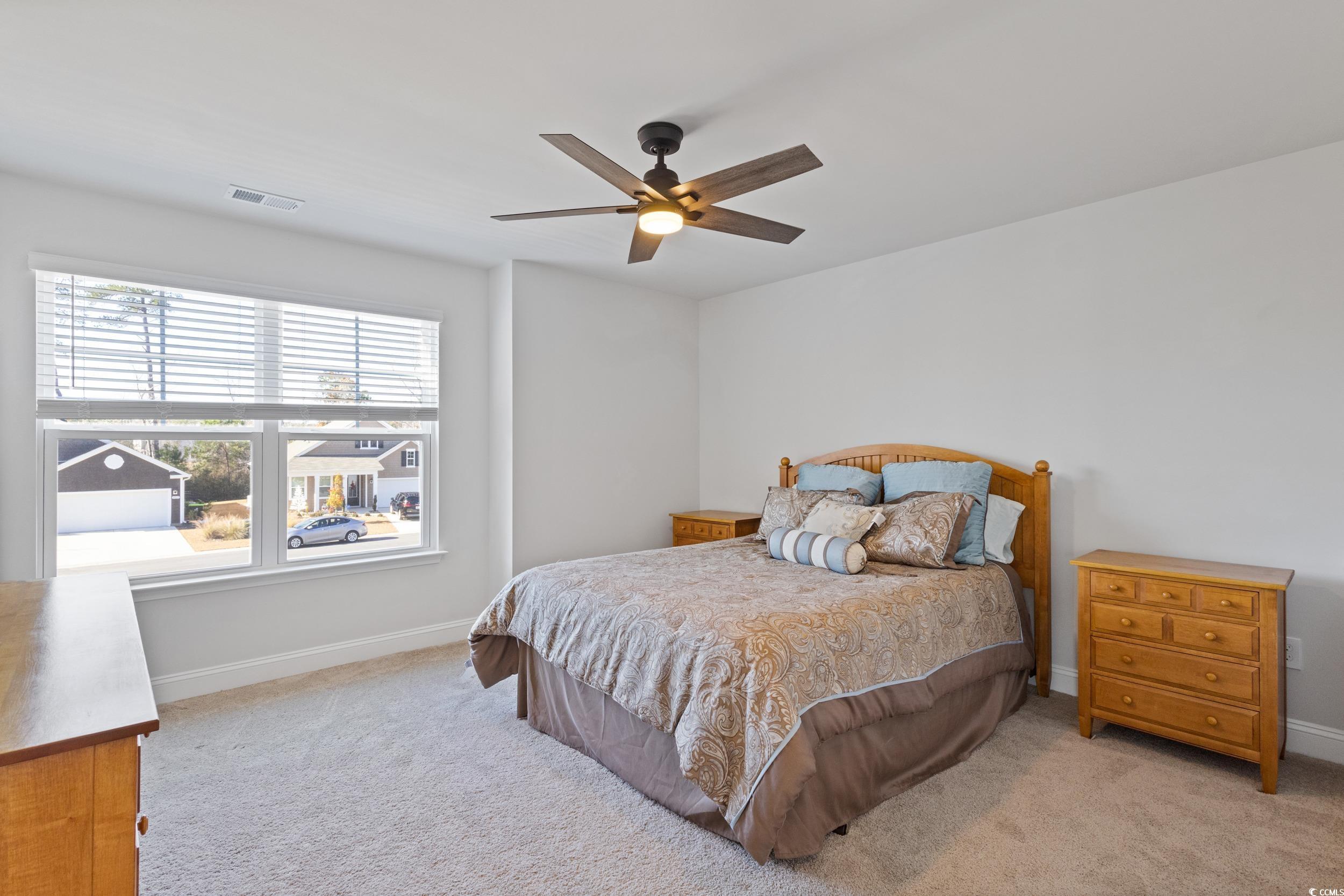 4070 Rutherford Court Little River, SC 29566 - Photo 30 of 40 Bedroom featuring light carpet and a ceiling fan