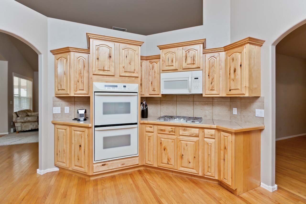 1426 19 Road Fruita, CO 81521 - Photo 8 of 42 a kitchen with stainless steel appliances granite countertop a stove and a refrigerator
