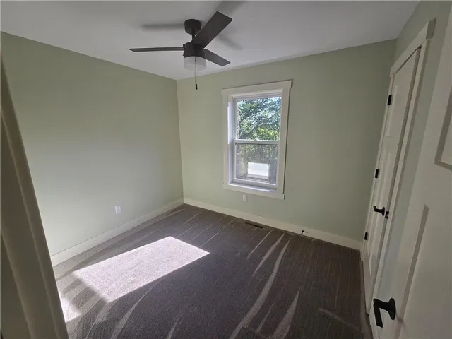 a view of wooden floor and windows in a room