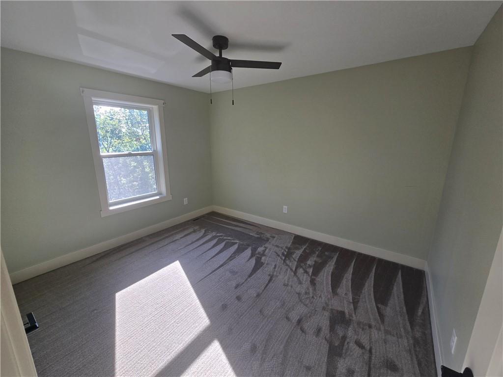 128 Reservoir Road, Unit B Mars, PA 16046 - Photo 14 of 18 a view of wooden floor and windows in a room