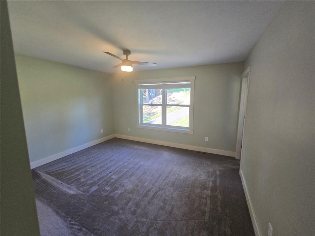 128 Reservoir Road, Unit B Mars, PA 16046 - Photo 15 of 18 an empty room with windows