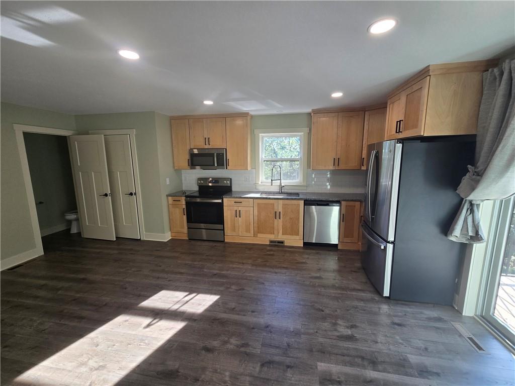 128 Reservoir Road, Unit B Mars, PA 16046 - Photo 6 of 18 a kitchen with stainless steel appliances granite countertop a refrigerator and a stove
