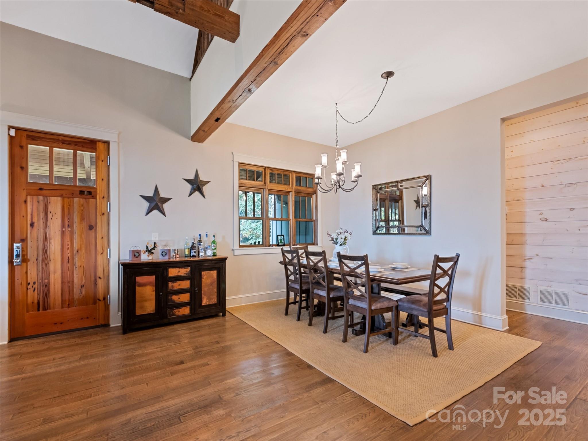 1635 Quest Ridge Sylva, NC 28779 - Photo 12 of 48 a view of a dining room with furniture window and wooden floor