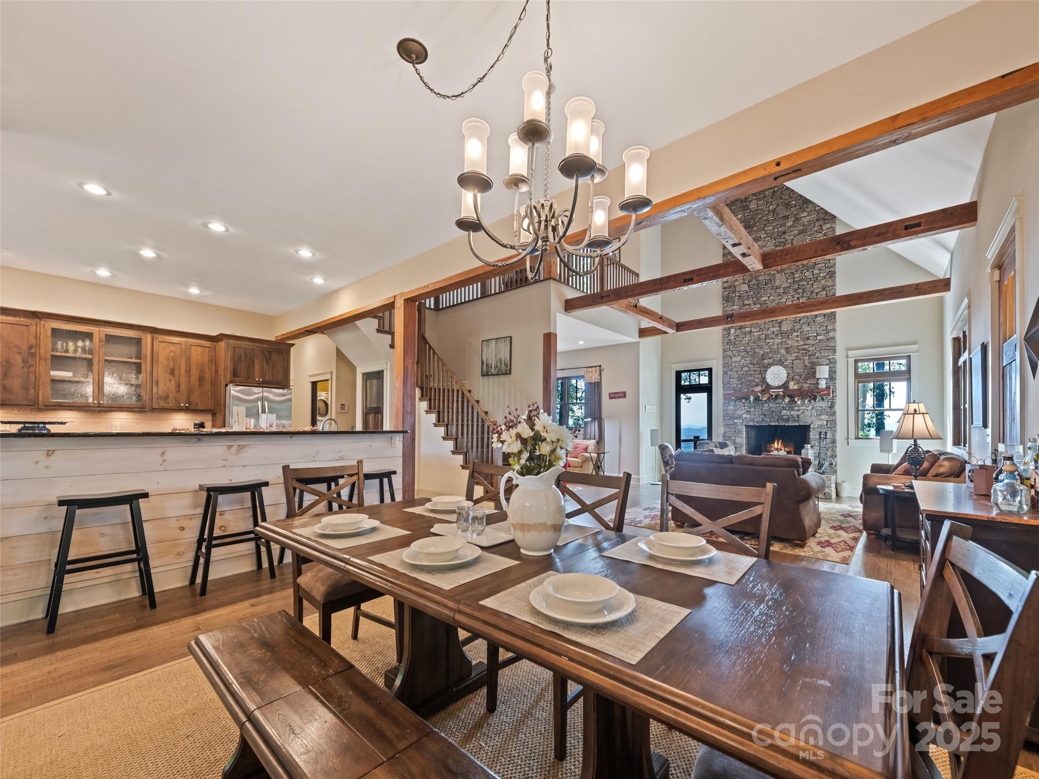 1635 Quest Ridge Sylva, NC 28779 - Photo 13 of 48 a view of a dining room with furniture wooden floor and chandelier