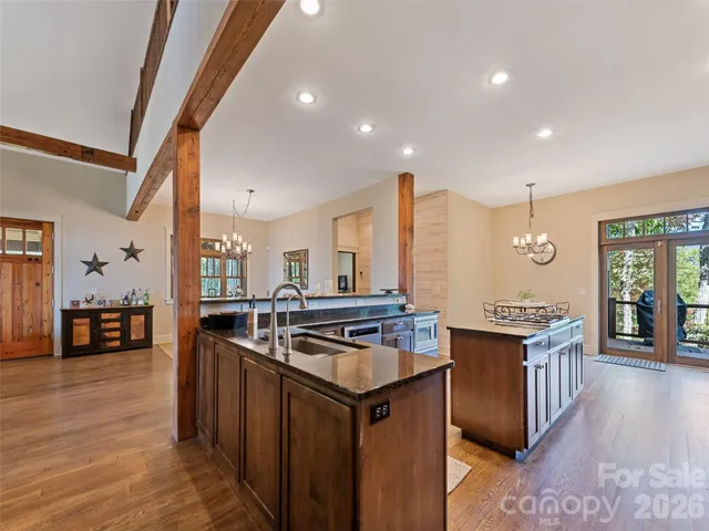 a kitchen with stainless steel appliances granite countertop a stove and a sink