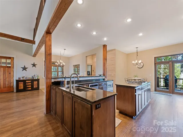 a kitchen with stainless steel appliances granite countertop a stove and a sink