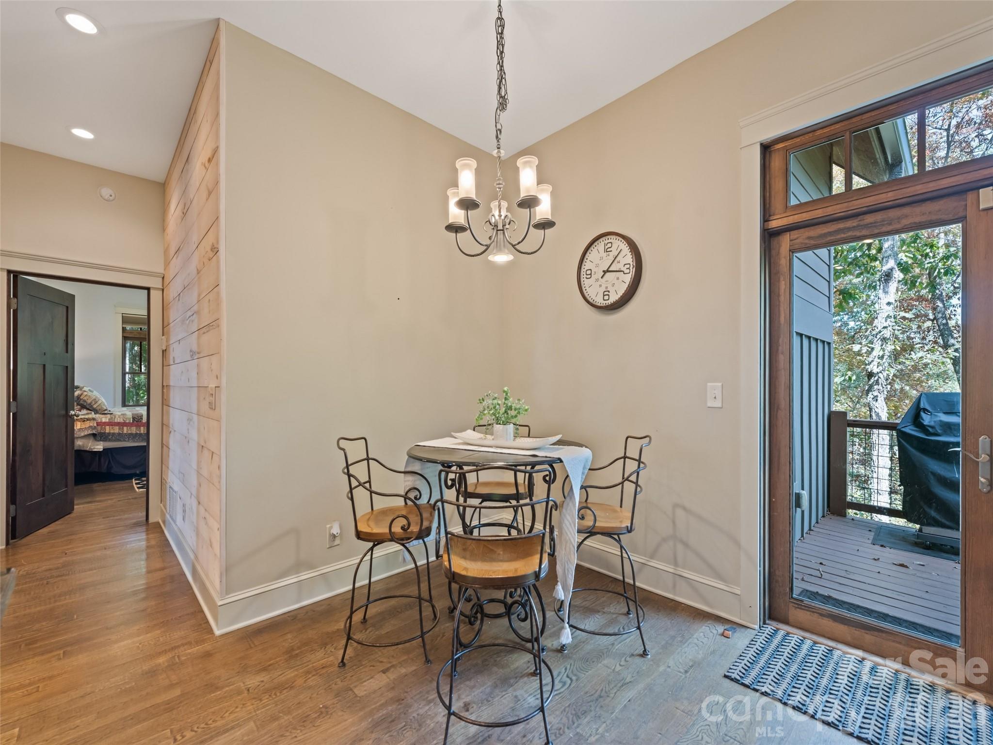 1635 Quest Ridge Sylva, NC 28779 - Photo 19 of 48 a view of a dining room with furniture window and wooden floor