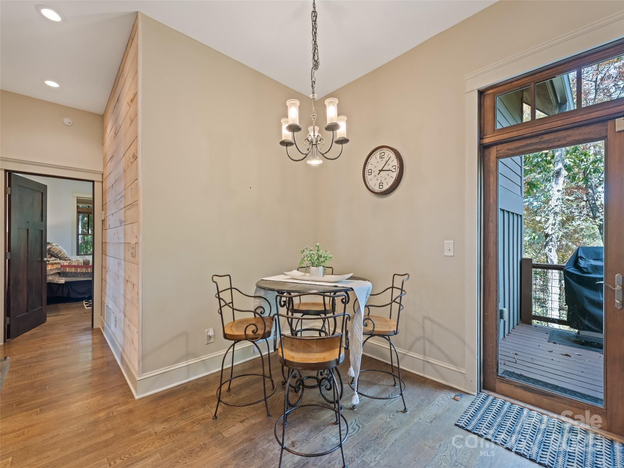 1635 Quest Ridge Sylva, NC 28779 - Photo 20 of 48 a view of a dining room with furniture window and wooden floor