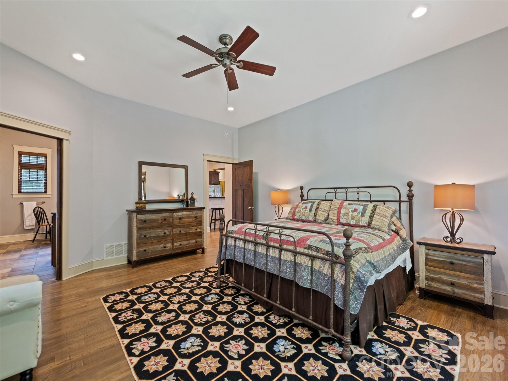 1635 Quest Ridge Sylva, NC 28779 - Photo 21 of 48 a bedroom with a bed and a chandelier
