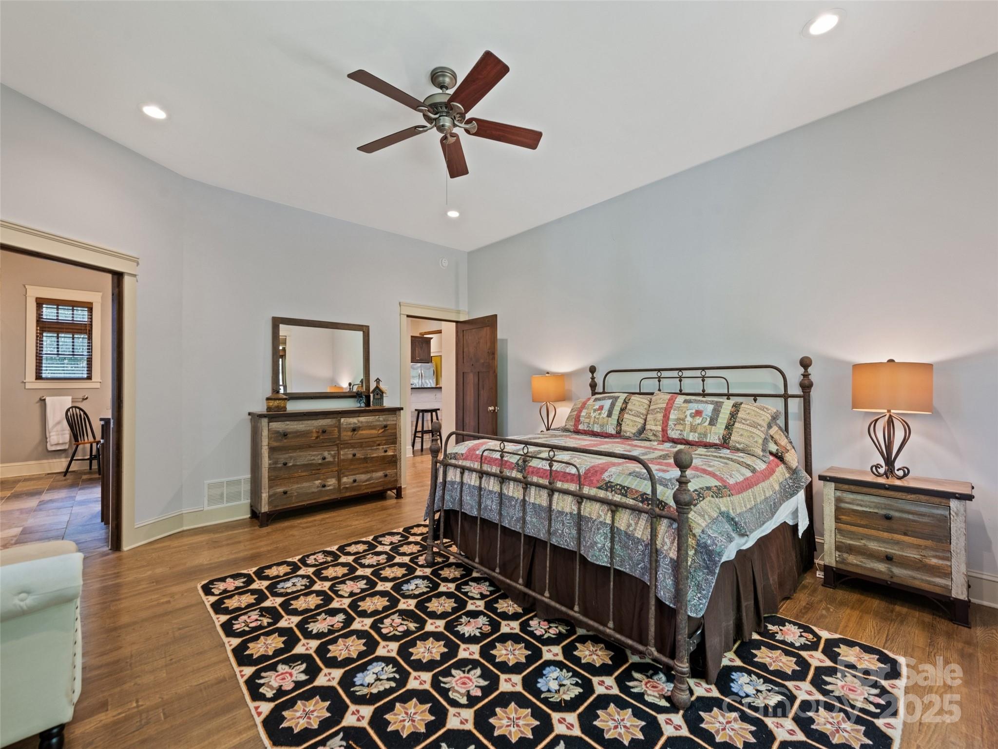 1635 Quest Ridge Sylva, NC 28779 - Photo 22 of 48 a bedroom with a bed and a chandelier