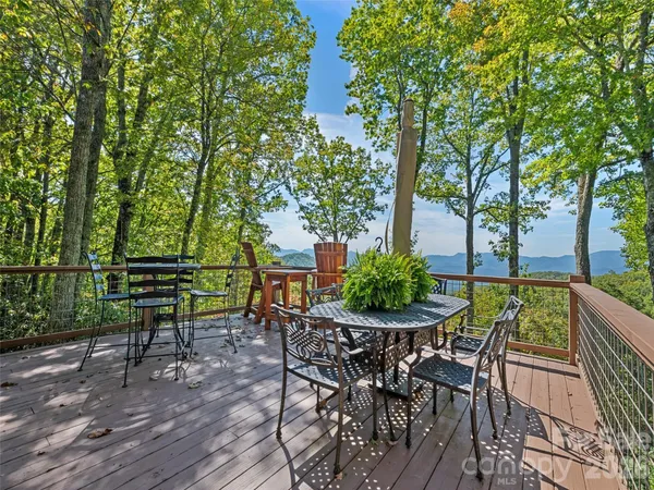 a view of a chairs and table in patio