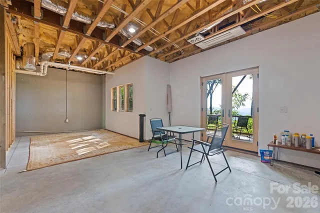a view of a livingroom with furniture and a window