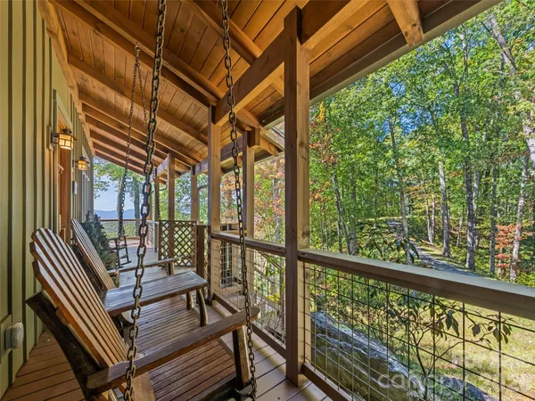 a view of a balcony with wooden floor