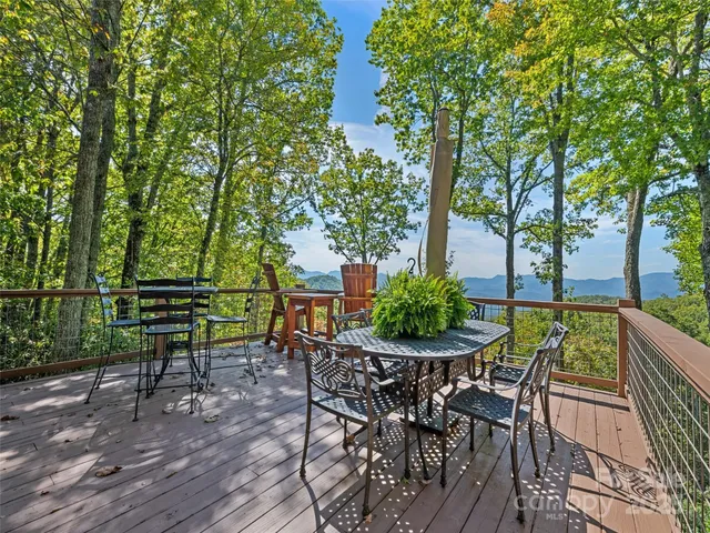 a view of a chairs and table in patio