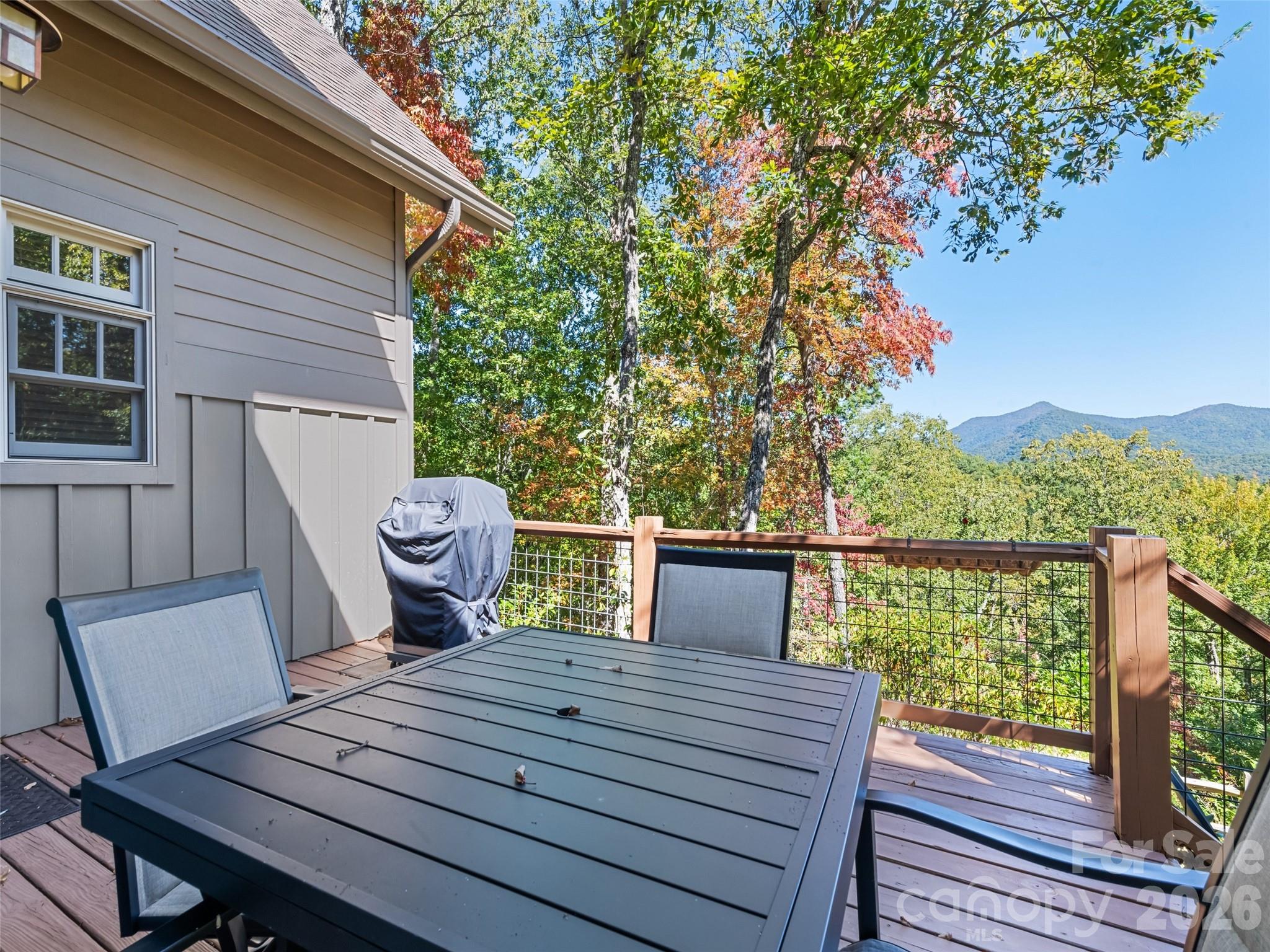 1635 Quest Ridge Sylva, NC 28779 - Photo 44 of 48 a view of a balcony with two chairs and a table