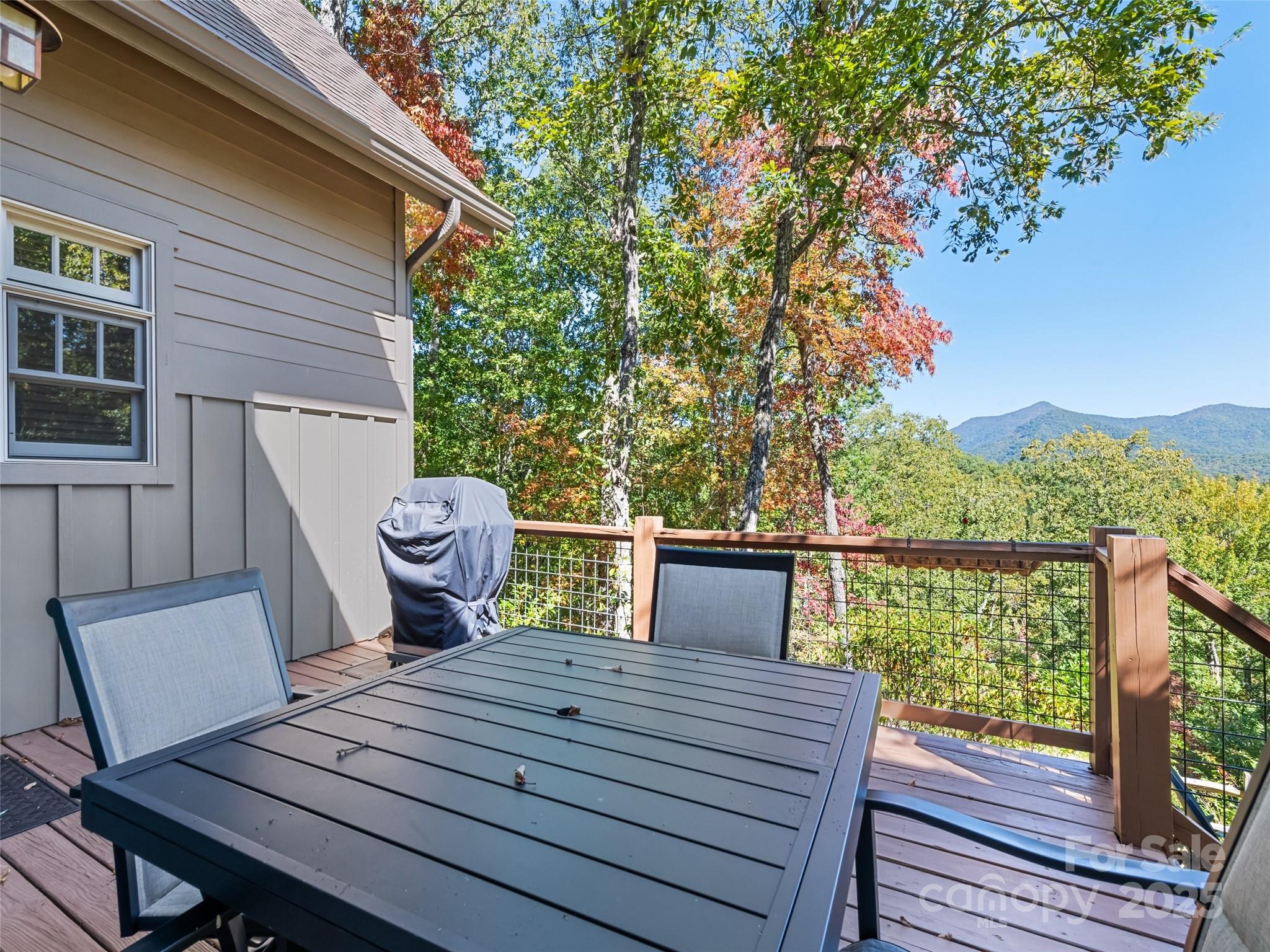1635 Quest Ridge Sylva, NC 28779 - Photo 44 of 48 a view of a deck with wooden floor and furniture