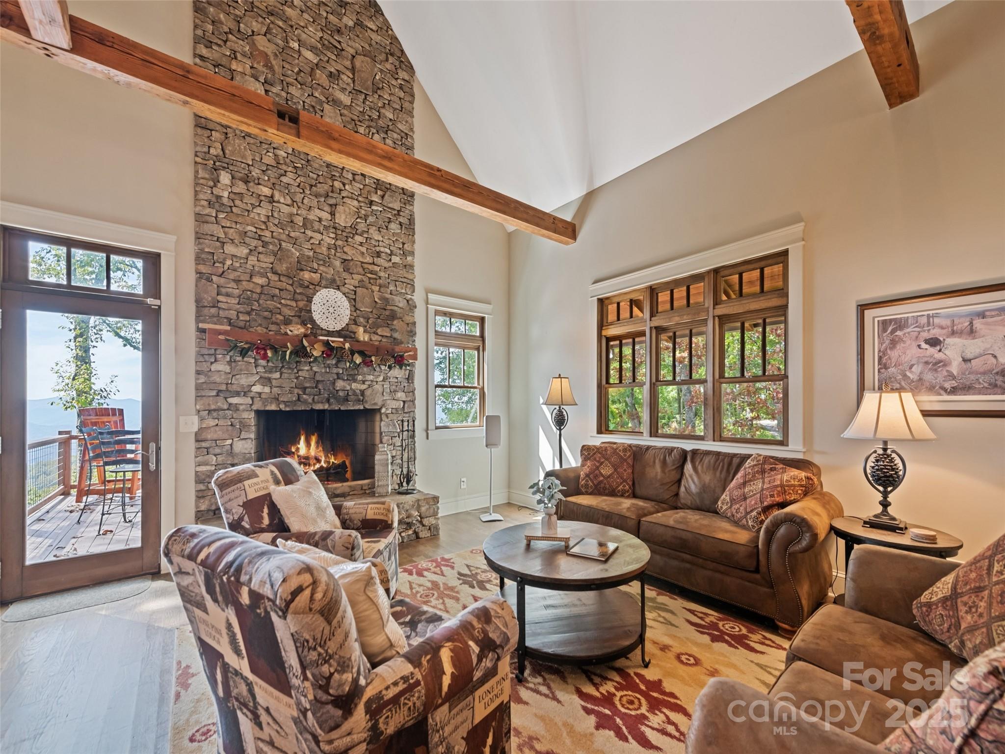 1635 Quest Ridge Sylva, NC 28779 - Photo 6 of 48 a living room with furniture a fireplace and a large window