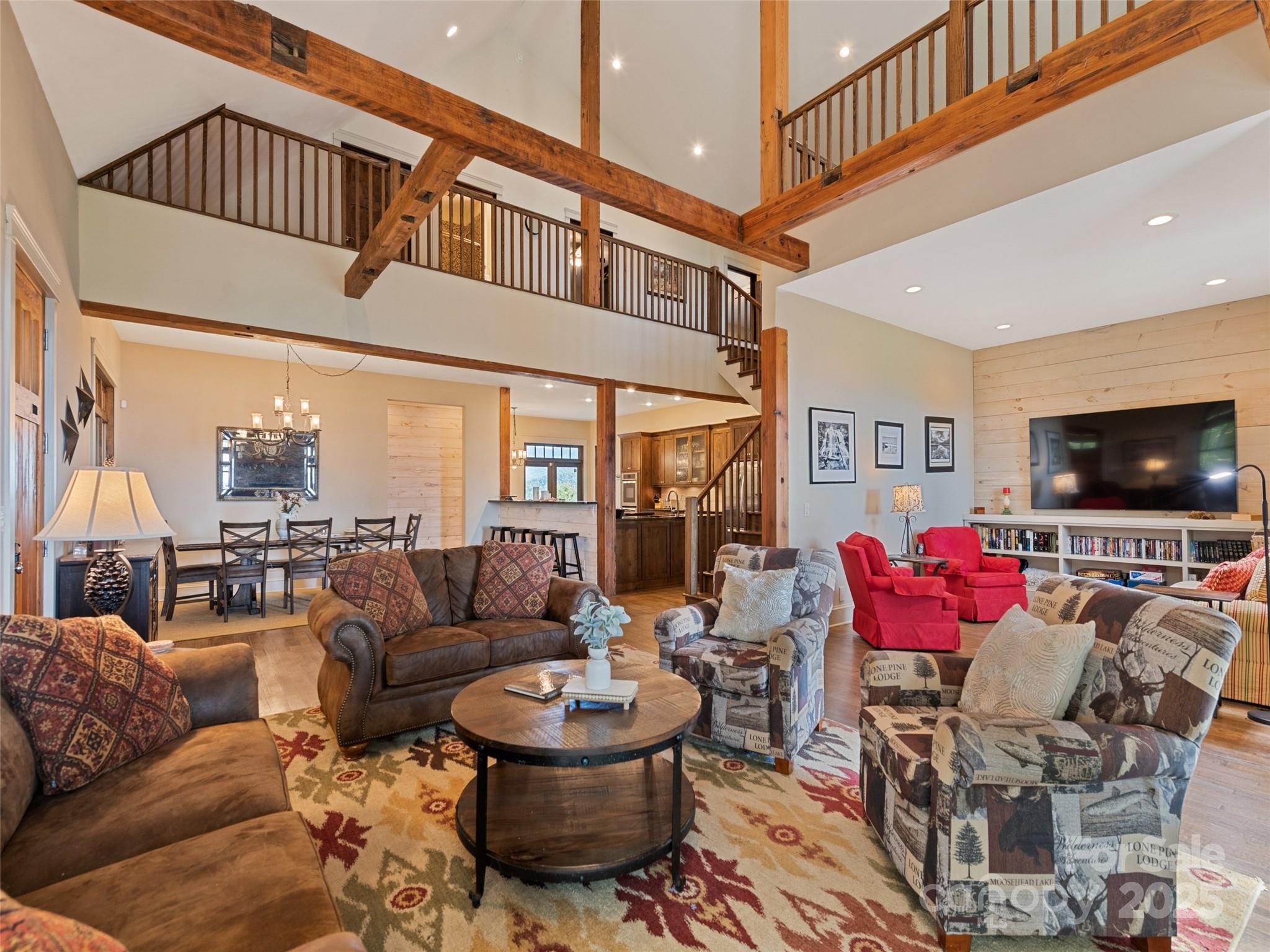 1635 Quest Ridge Sylva, NC 28779 - Photo 8 of 48 a living room with furniture and a flat screen tv