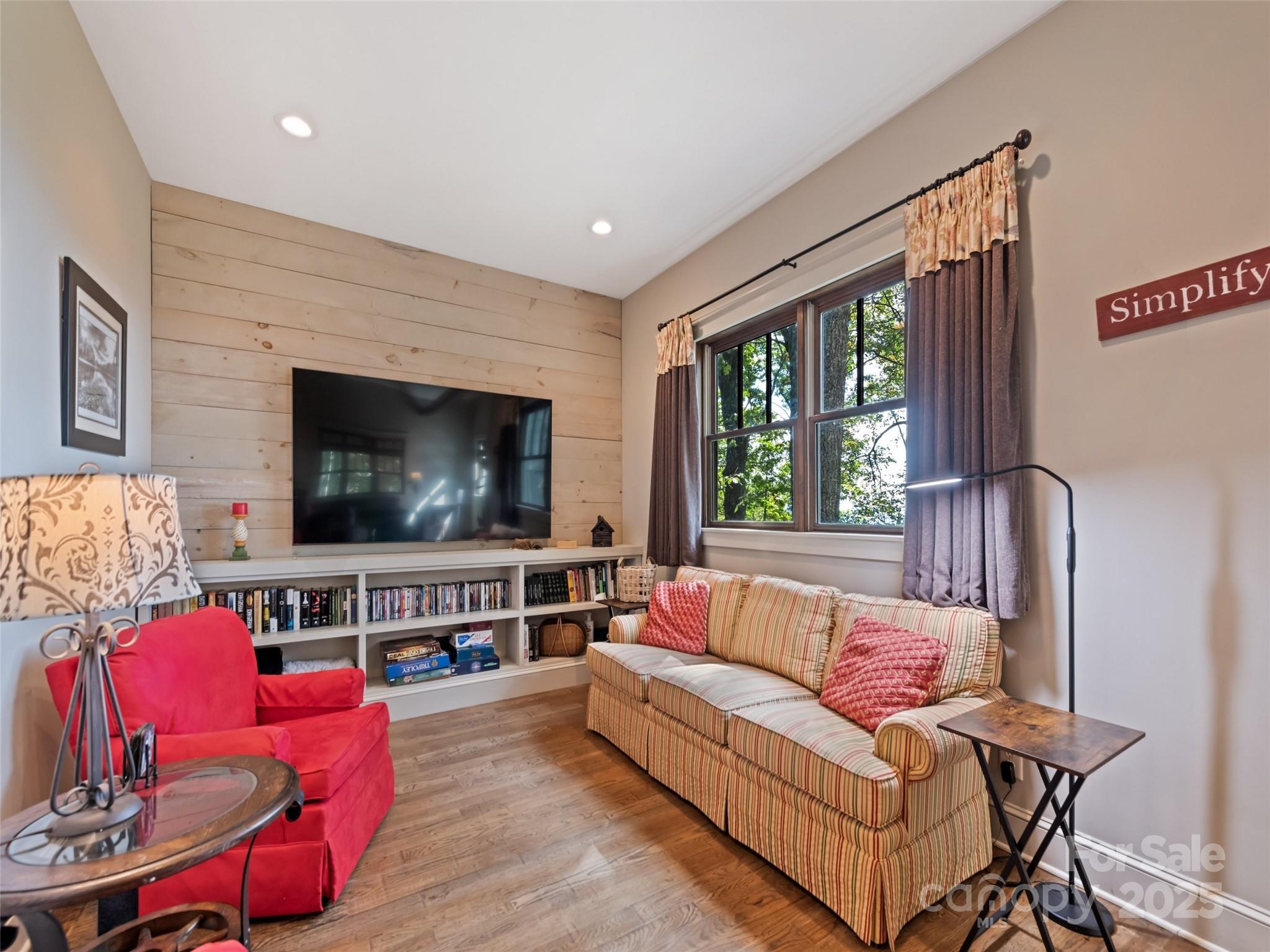 1635 Quest Ridge Sylva, NC 28779 - Photo 10 of 48 a living room with furniture and a flat screen tv