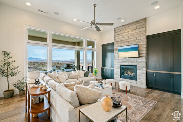 6026 Zen Trail Way St. George, UT 84790 - Photo 8 of 41 Living area with hardwood / wood-style floors, a ceiling fan, recessed lighting, and a stone fireplace