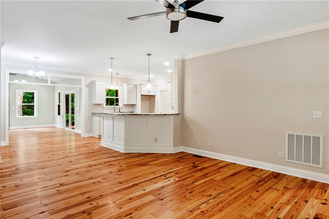 110 Gabriel Way Pickens, SC 29671 - Photo 48 of 48 An open floorplan with natural hardwood flooring and a stylish kitchen island perfect for entertaining.