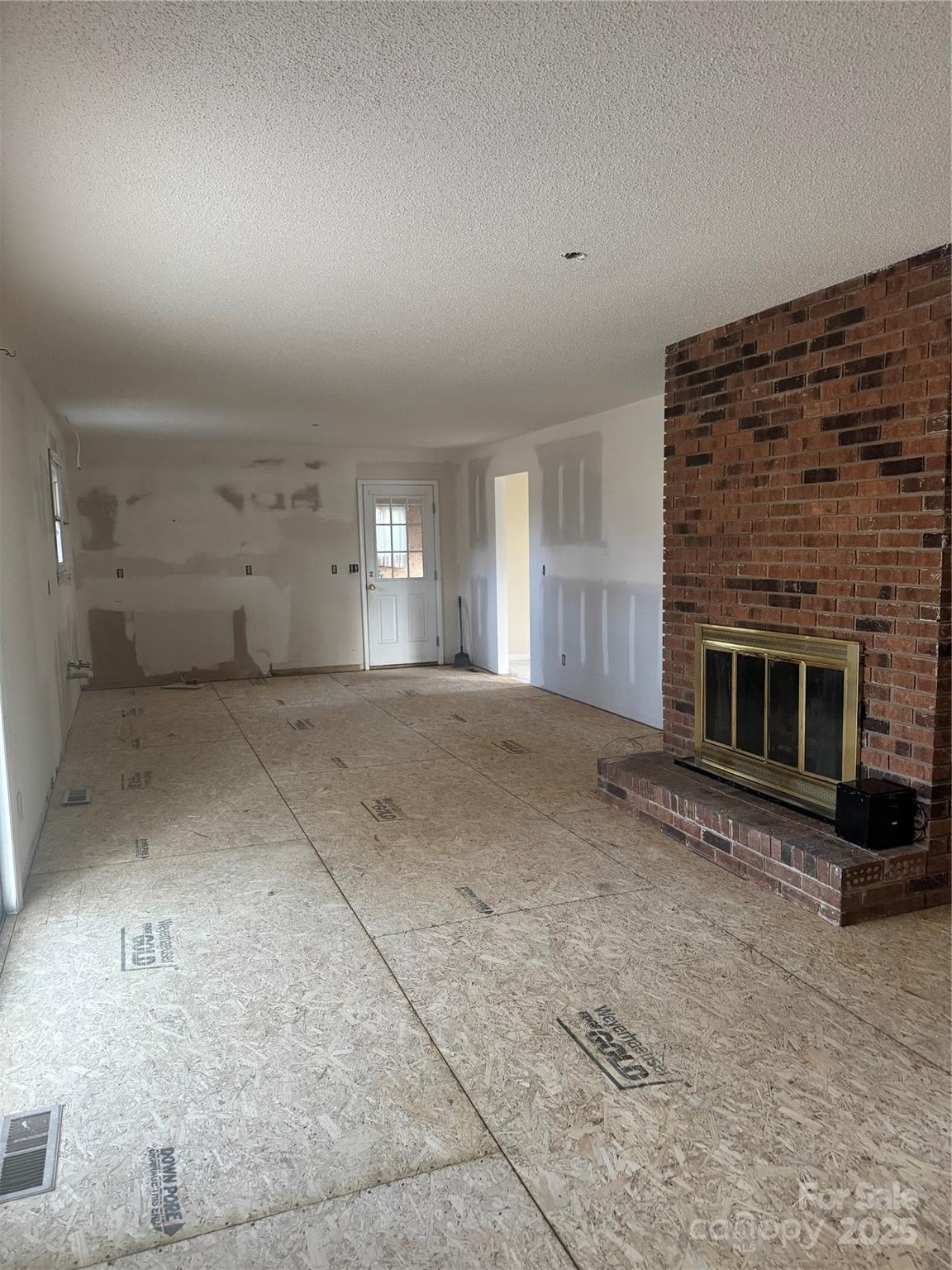 29 Westfield Road Fletcher, NC 28732 - Photo 2 of 10 a view of empty room with a fireplace