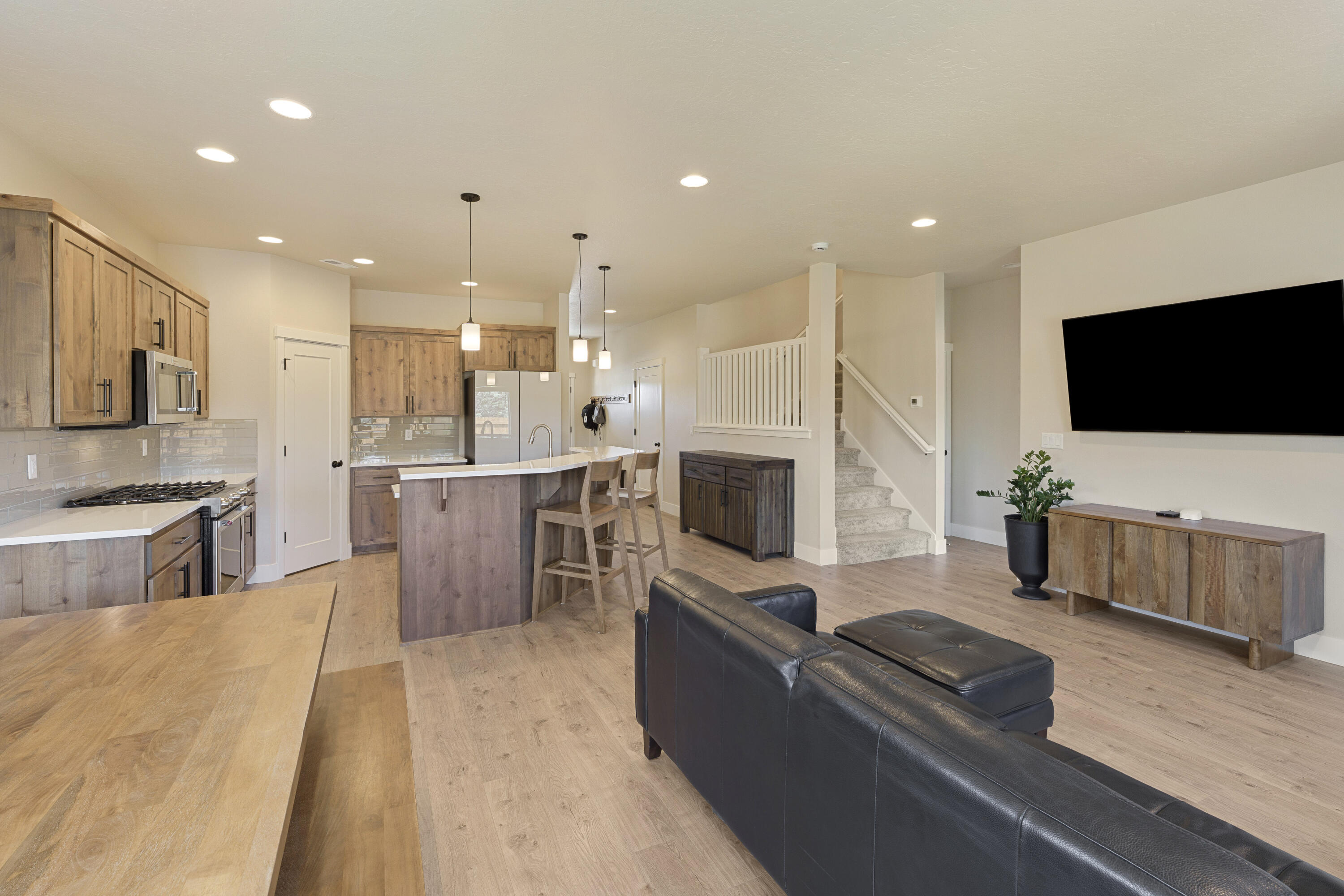 4999 Southwest Yew Place Redmond, OR 97756 - Photo 19 of 50 a living room with furniture and a flat screen tv