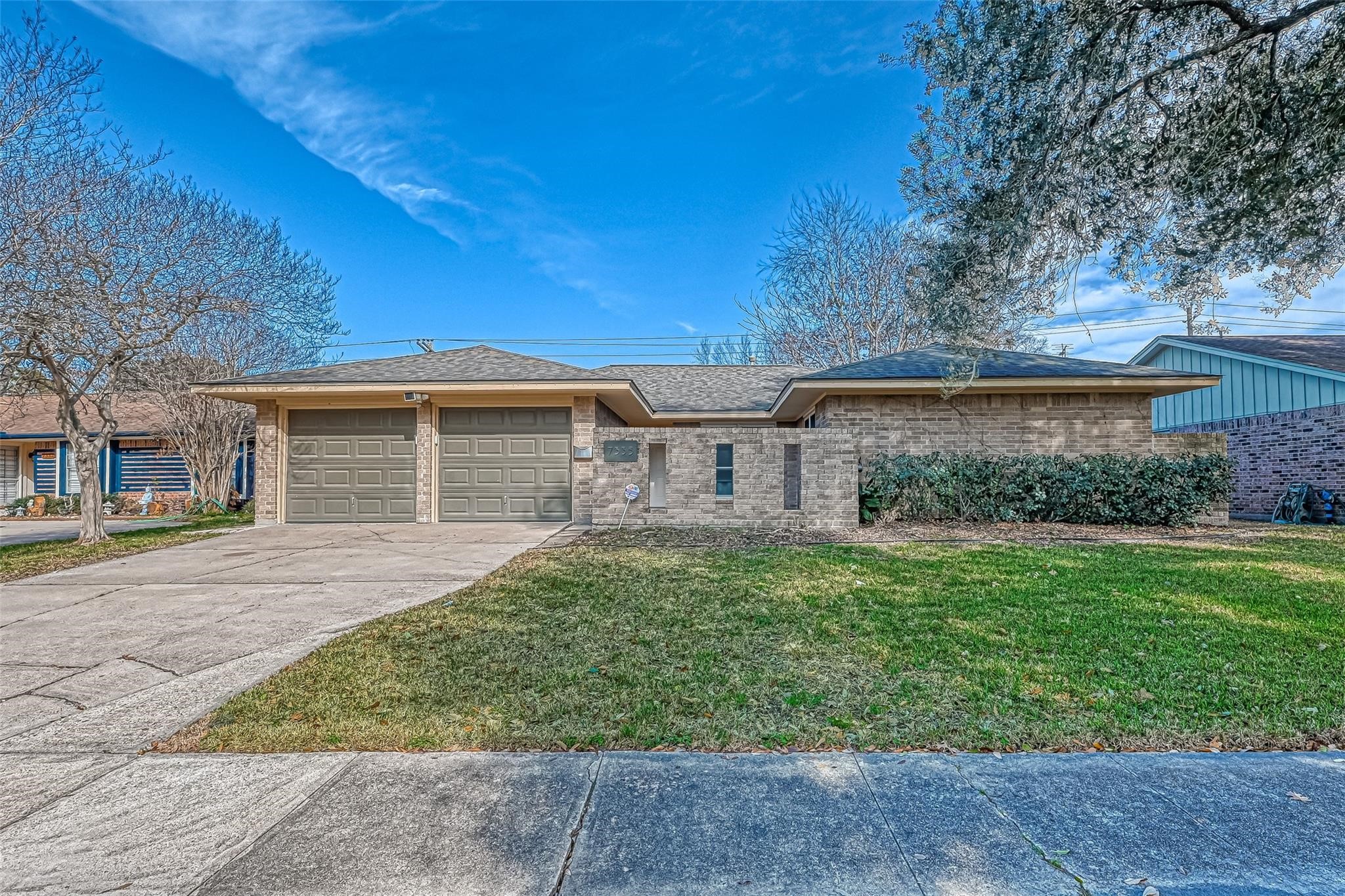 front view of a house with a yard