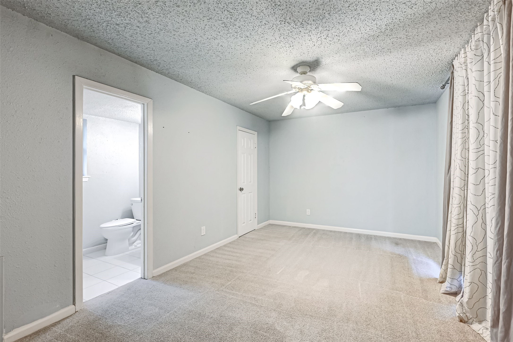 7335 Osage Street Houston, TX 77036 - Photo 11 of 12 wooden floor in a room next to a white cabinet and a chandelier