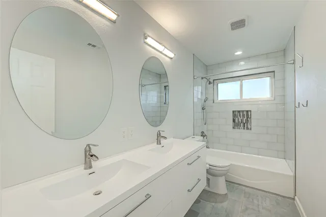 a bathroom with a bathtub a sink and a mirror
