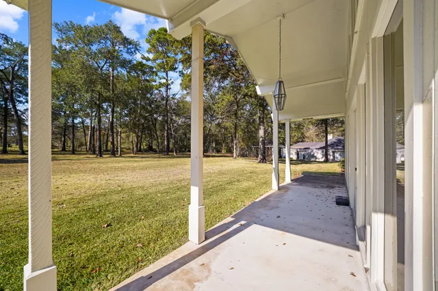 a view of a kitchen with wooden floor and a kitchen
