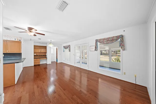 a large kitchen with stainless steel appliances granite countertop a stove sink and cabinets