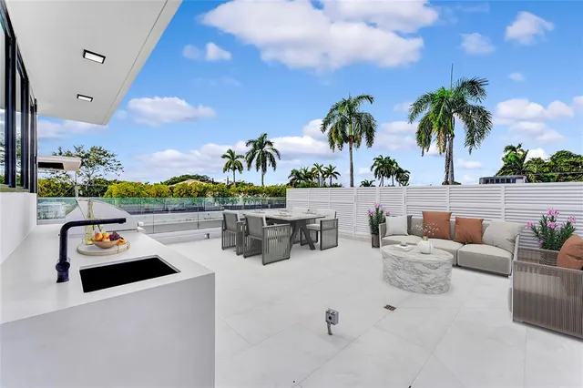 a kitchen with appliances cabinets and a large window