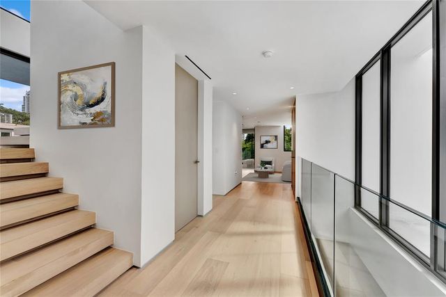 a very nice looking open kitchen with stainless steel appliances granite countertop a refrigerator and a sink