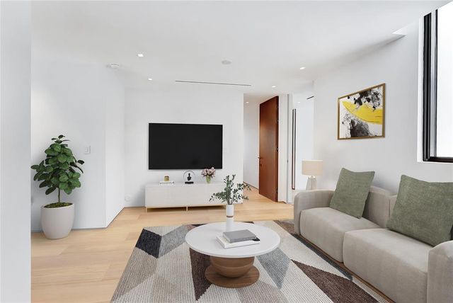 a view of a living room and dining room