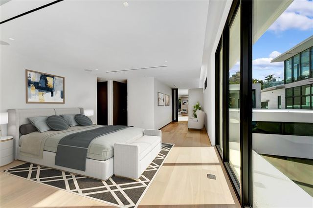 a view of an outdoor dining space with a table and chairs