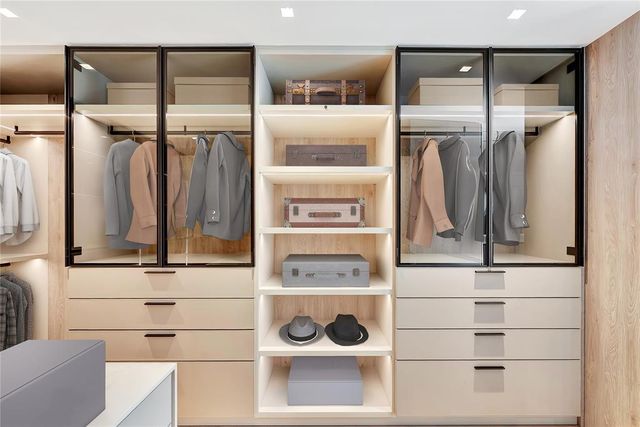 a view of a dining room with furniture and a potted plant