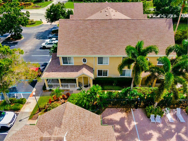 an aerial view of a house with a yard and a garden