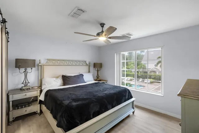 a bedroom with a large bed and a window