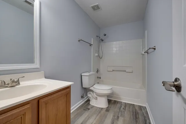 a bathroom with a sink toilet a shower and a mirror